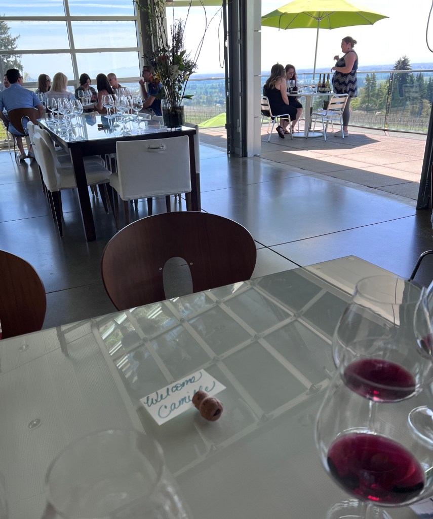 Airy indoor and outdoor seating at Winderlea, a biodynamic winery, in the Willamette Valley.